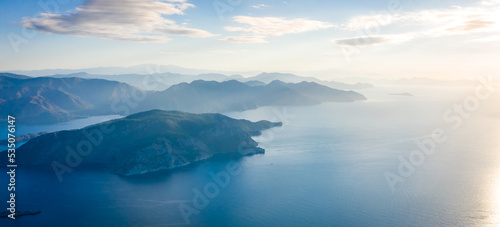 Landscape at sunrise overlooking the mediterranean sea and mountains. View of Turunk and Keci island. Turkey in summer, Marmaris area © Alexey Oblov