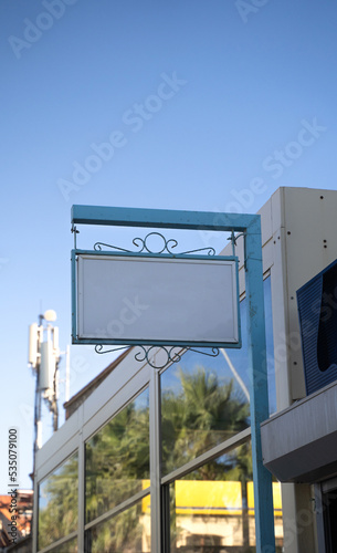 empty shop sign hanging from the ceiling mockup signboard 