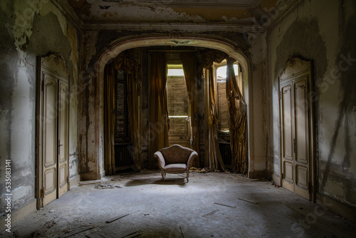 Decay living room in an abandoned liberty mansion in Northern Italy photo