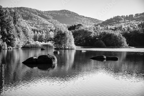 Autumn beech forest reflecter in the water photo