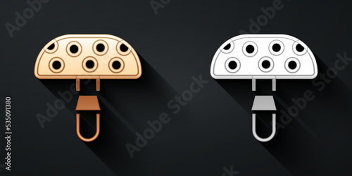 Gold and silver Amanita muscaria or fly agaric hallucinogenic toadstool mushroom icon isolated on black background. Spotted poisonous mushroom. Long shadow style. Vector