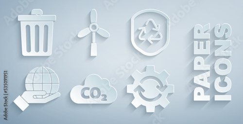Set CO2 emissions in cloud, Recycle symbol inside shield, Hand holding Earth globe, Gear arrows as workflow, Wind turbine and Trash can icon. Vector