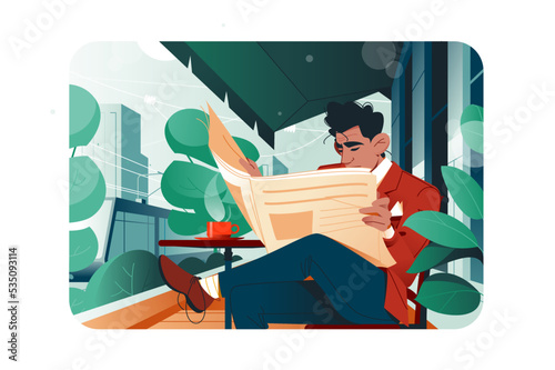 Handsome man sitting in cafe and reading morning press