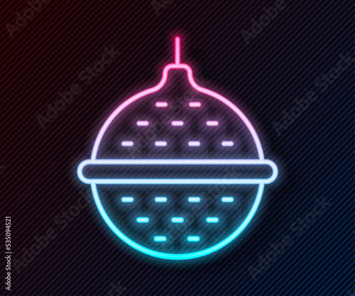 Glowing neon line Ball tea strainer icon isolated on black background. Vector