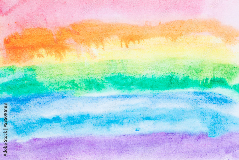 Hand painted abstract watercolor background on paper in rainbow colors