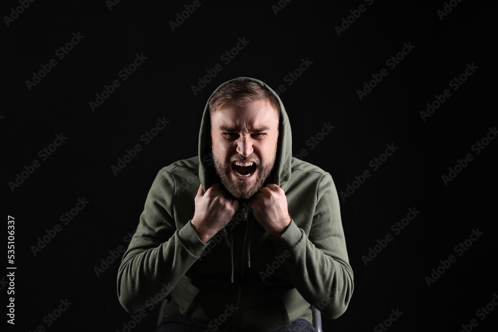 Portrait of emotional young man on black background. Personality concept Portrait of emotional young man on black background. Personality concept