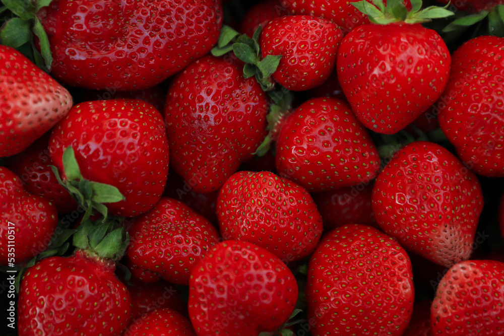 Heap of ripe red strawberries as background, top view Heap of ripe red strawberries as background, top view