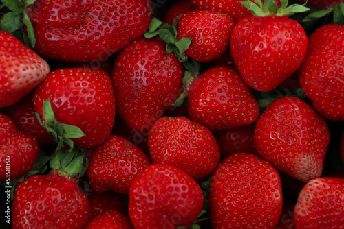 Heap of ripe red strawberries as background, top view