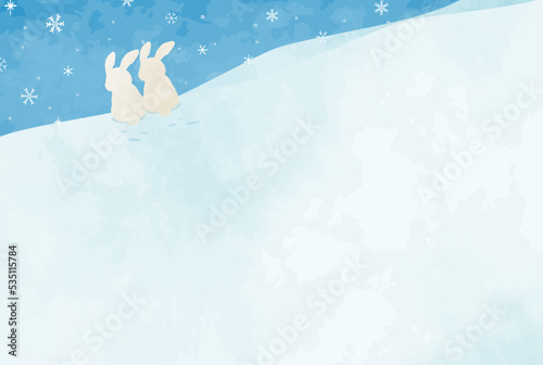 冬をイメージした手描きのウサギと雪山の風景イラスト