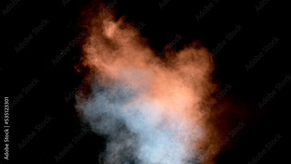 Scene glowing orange, blues moke. Atmospheric smoke, abstract color background, close-up. Royalty high-quality free stock of Vibrant colors spectrum. Orange mist or smog moves on black background