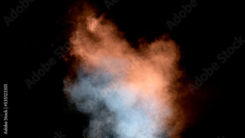 Scene glowing orange, blues moke. Atmospheric smoke, abstract color background, close-up. Royalty high-quality free stock of Vibrant colors spectrum. Orange mist or smog moves on black background