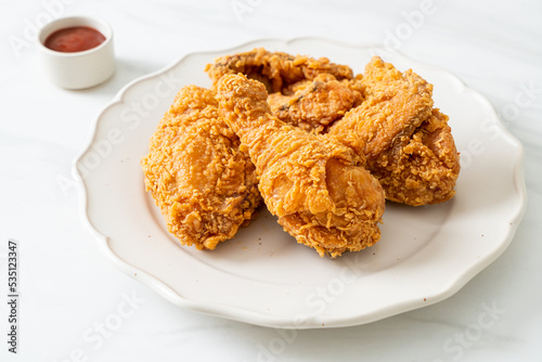 fried chicken with ketchup on plate