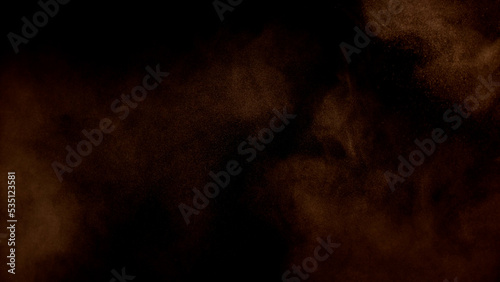 Scene glowing orange, yellow smoke. Atmospheric abstract color background, close-up. Royalty high-quality free stock of Vibrant colors spectrum. Yellow, orange mist or smog moves on black backgrounds