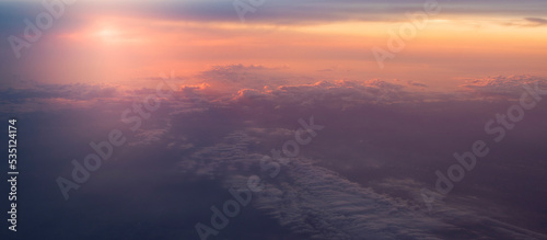 Dramatic sunset panorama from above the clouds