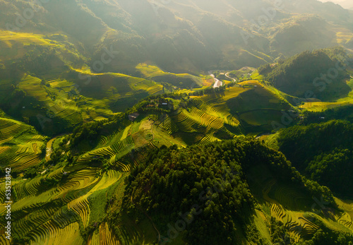 Aerial view of golden rice terraces at Mu cang chai town near Sapa city, north of Vietnam. Beautiful terraced rice field in harvest season in Yen Bai, Vietnam