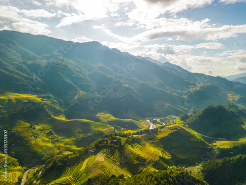 Aerial view of golden rice terraces at Mu cang chai town near Sapa city  north of Vietnam. Beautiful terraced rice field in harvest season in Yen Bai  Vietnam