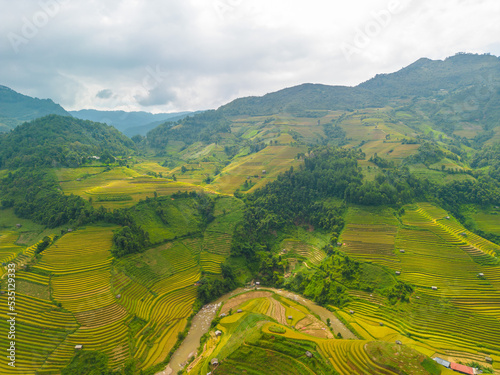 Aerial view of golden rice terraces at Mu cang chai town near Sapa city, north of Vietnam. Beautiful terraced rice field in harvest season in Yen Bai, Vietnam