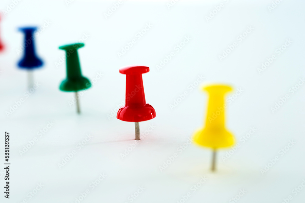 Push pins in a row isolated on white Push pins in a row isolated on white