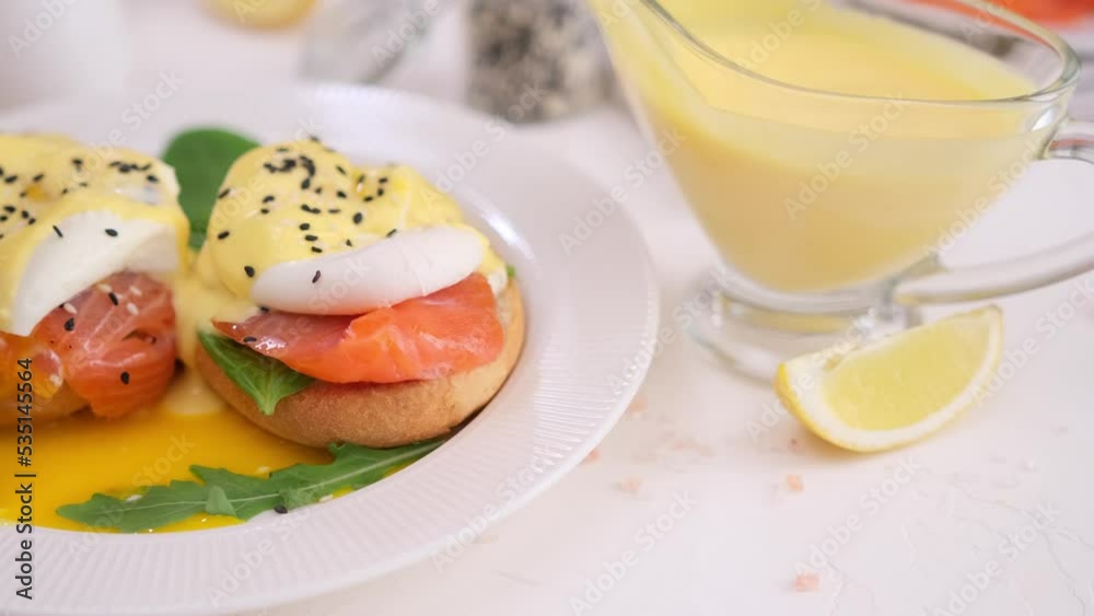 tasty benedict egg breakfast - Salmon fillet sandwich with cream cheese and poached egg at domestic kitchen tasty benedict egg breakfast - Salmon fillet sandwich with cream cheese and poached egg at domestic kitchen
