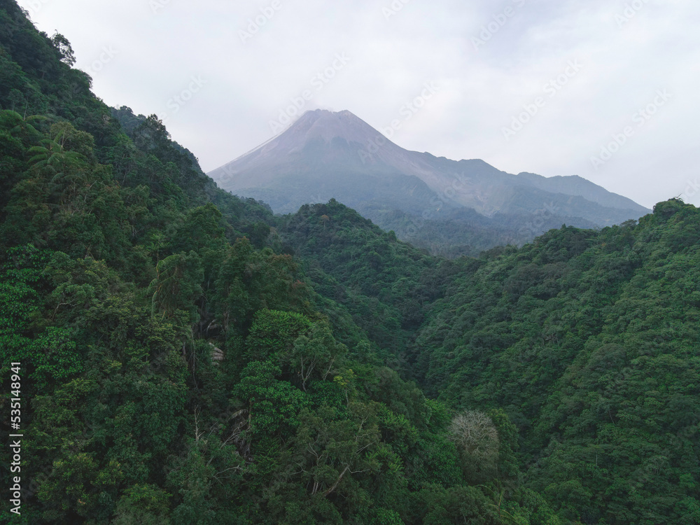 Aerial view of Merapi Mountain in indonesia with tropical forest around it