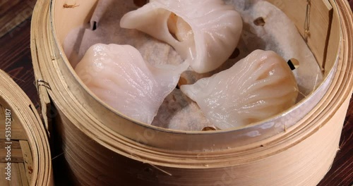 crystal har gow transparent prawn shrimp chicken meat stuffed dim sum in bamboo steamer rotate 