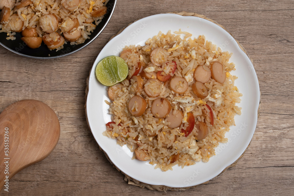Sausage fried rice with egg and vegetables in white plate Sausage fried rice with egg and vegetables in white plate
