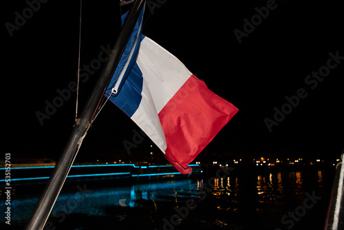 france flag french blue white red wave flutters mat on boat at night sky photo