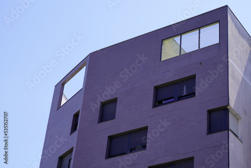 Modern residential apartment white facade building grey cement facade