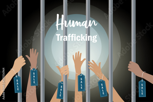 Human Trafficking and human rights concept. Abused hands with sale label tag imprisonment in jail bars asking hopeless for help.