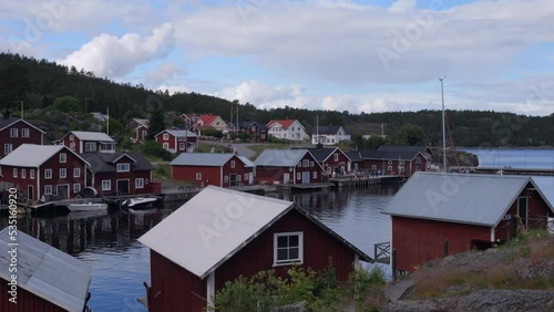 Wallpaper Mural Panning view of typical Nordic  village with red houses at the sea. Slow motion. Bonhamn. Sweden Torontodigital.ca