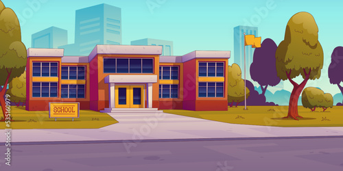 Modern school building in big city. Cartoon vector illustration of educational institution surrounded by clean territory with green lawn, tall trees and flagpole. Blue sky and cityscape background