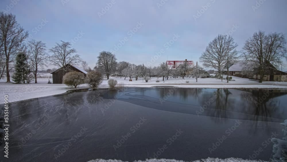 Starting in autumn, this all-year time lapse of a farmhouse by a lake cycles to winter with the lake freezing, to spring and then to summer in a temperate European climate Starting in autumn, this all-year time lapse of a farmhouse by a lake cycles to winter with the lake freezing, to spring and then to summer in a temperate European climate