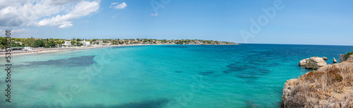 Extra wide view of a beautiful beach with clear and crystalline turquoise water and fine sand in Sicily in Syracuse called Fontane Bianche