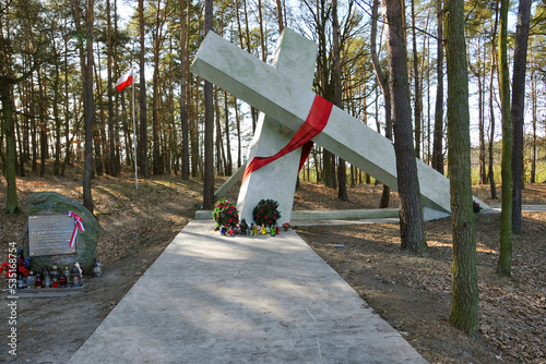 Overturned cross and stone, monuments at the place where Jerzy Popieluszko was kidnapped by Security Service of the Ministry of Internal Affairs. Gorsk, Kuyavian-Pomeranian Voivodeship, Poland. photo