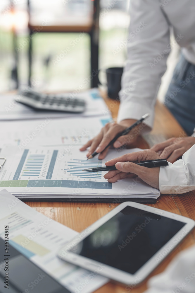 Two businesswoman working, discussing business plan and strategy at office desk. Business casual meeting. Two businesswoman working, discussing business plan and strategy at office desk. Business casual meeting.