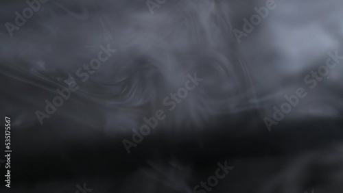 Cinematic light rays with smoke in the air and atmospheric effect for overlay on a black background photo