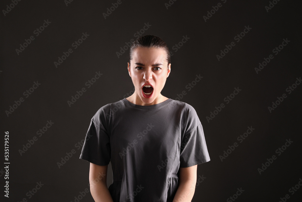 Portrait of emotional young woman on black background. Personality concept Portrait of emotional young woman on black background. Personality concept