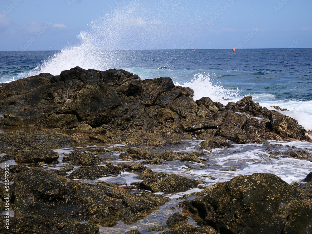 Rocks are washed over by waves from the sea Rocks are washed over by waves from the sea