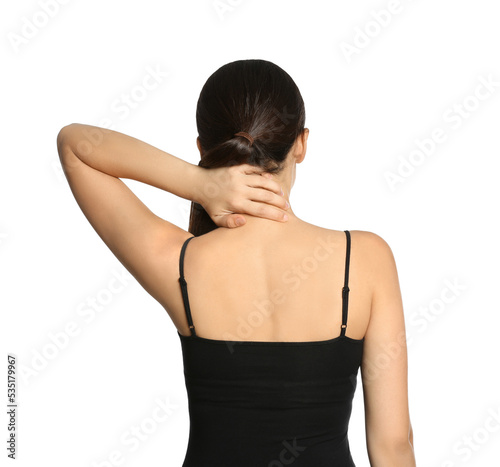 Young woman suffering from neck pain on white background, back view