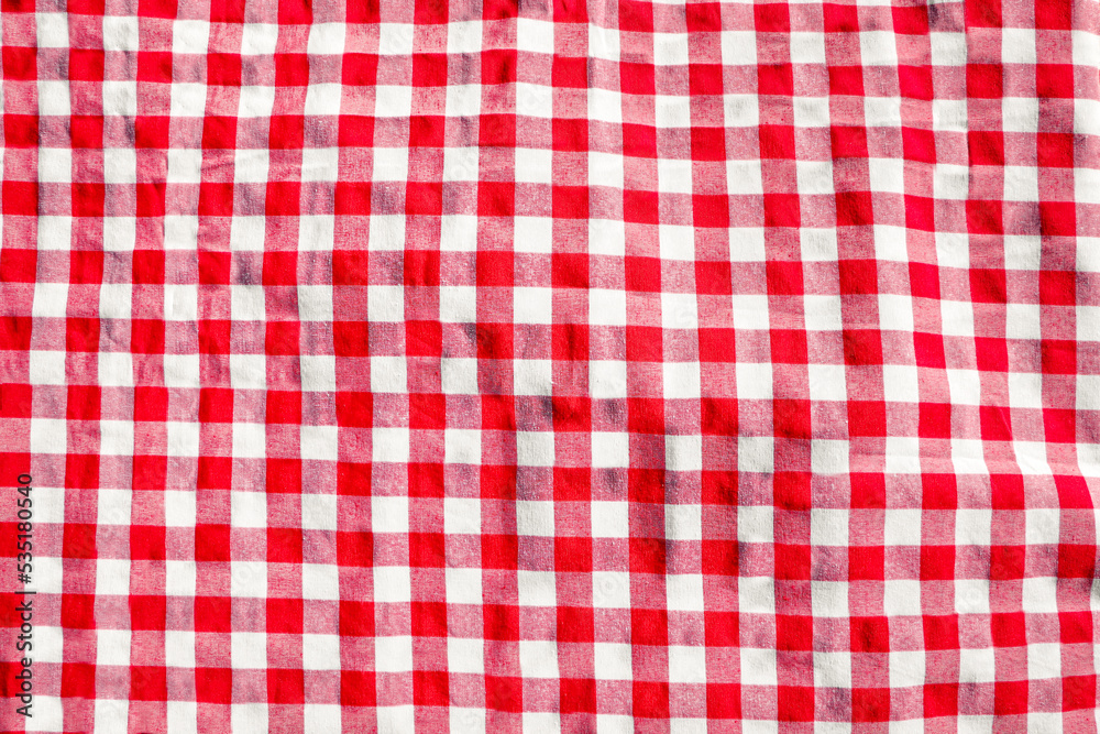 Red checkered picnic tablecloth as background, top view Red checkered picnic tablecloth as background, top view