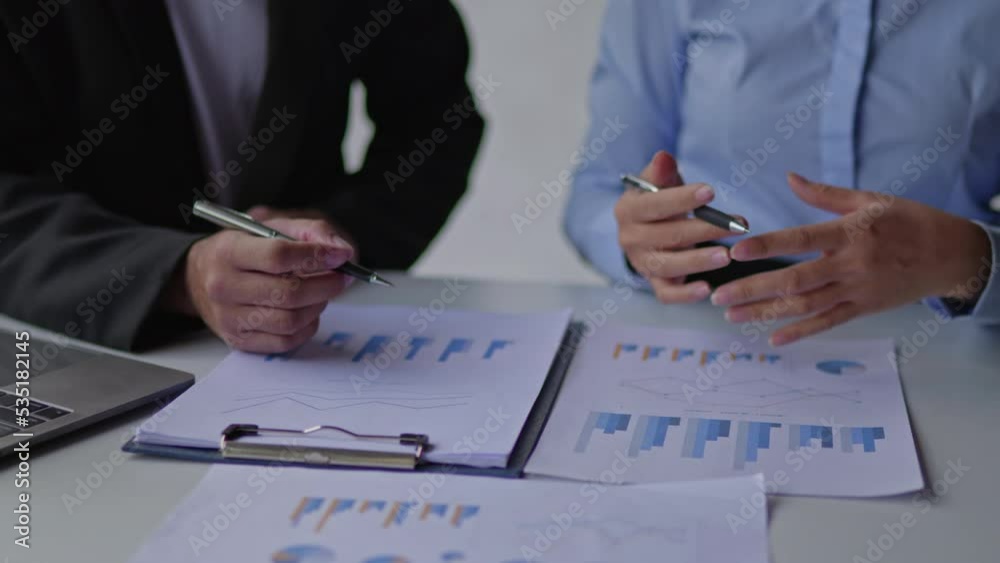 Close up of hands business teamwork are working and brainstorming calculate on paperworks about business financial and marketing that shows chart and graft of accounting statistics, number of cost. Close up of hands business teamwork are working and brainstorming calculate on paperworks about business financial and marketing that shows chart and graft of accounting statistics, number of cost.
