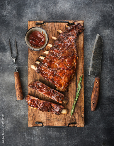 Delicious smoked pork ribs glazed in BBQ sauce.