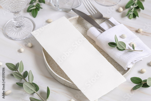 Elegant Table setting with a card decorated with eucalyptus branches close up, Wedding mockup