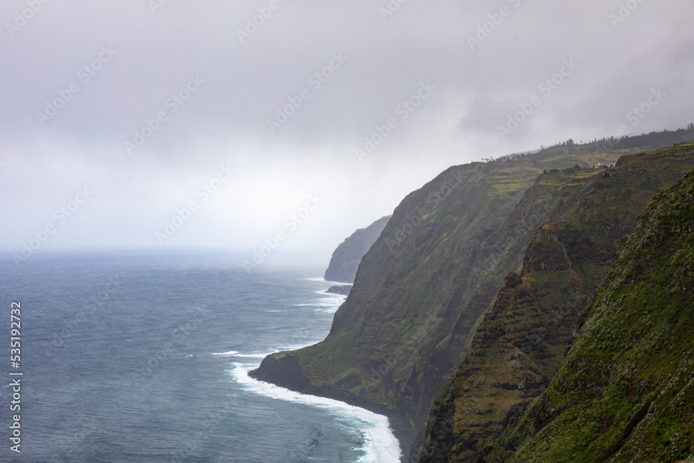 Farol da Ponta do Pargo coastline on rainy day	