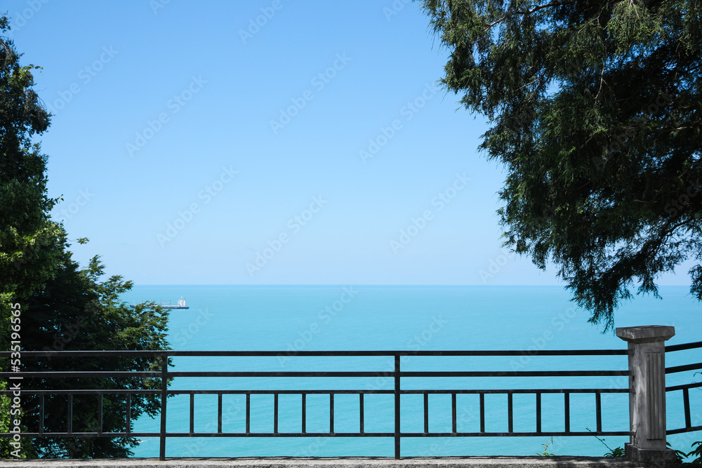 Picturesque view of beautiful sea and fence on sunny day