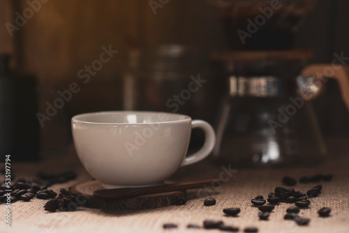 white hot coffee mug and coffee beans