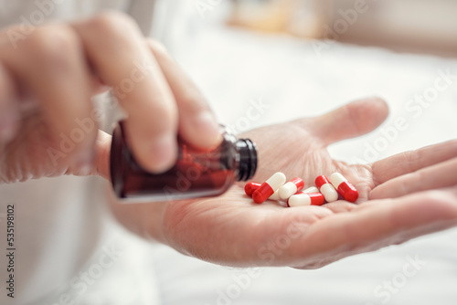 Taking prescription medicine pills daily morning routine