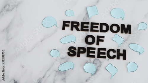 freedom of speech text surrounded by group of different comic bubbles representing diverse opinions and points of view