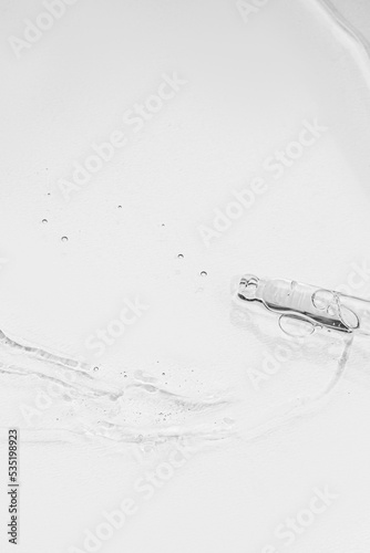 Laboratory equipment with advertising backgrounds. Medical flasks, bowls. Chemical laboratory research of cosmetics. Serums for the face.