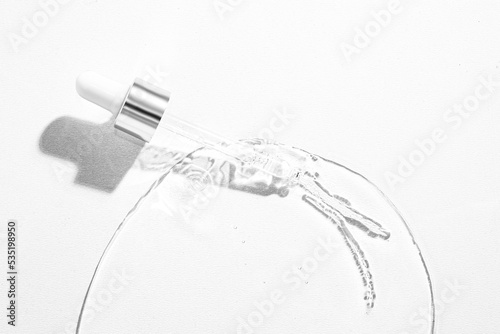 Laboratory equipment with advertising backgrounds. Medical flasks, bowls. Chemical laboratory research of cosmetics. Serums for the face.